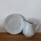 5 tasses 4 soucoupes et un crémier en porcelaine Philippe Deshoulières