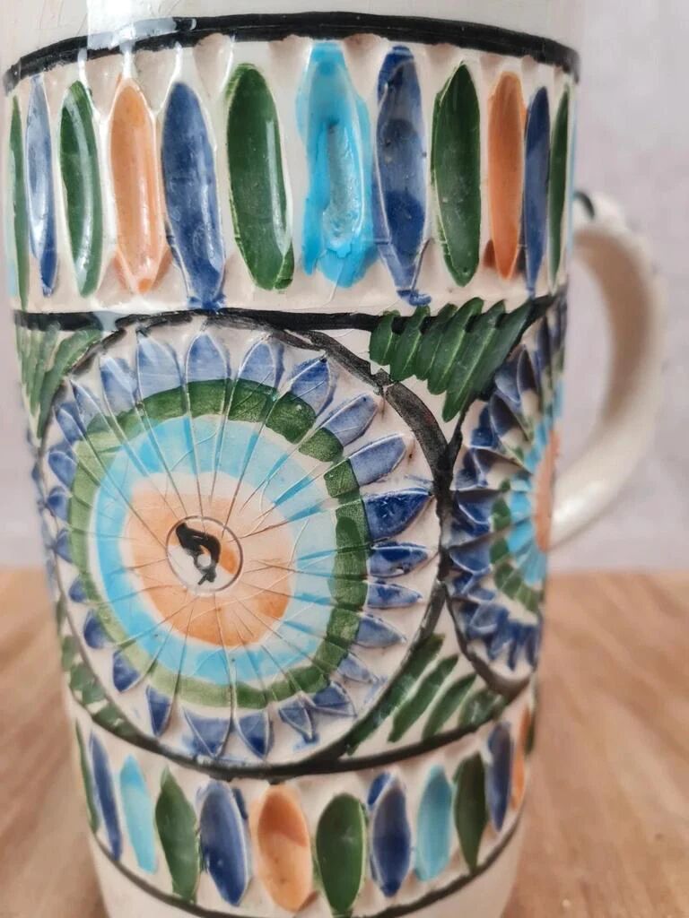 Old pitcher in Tunisian earthenware with colourful decoration.