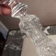 Old push-up in moulded thick glass