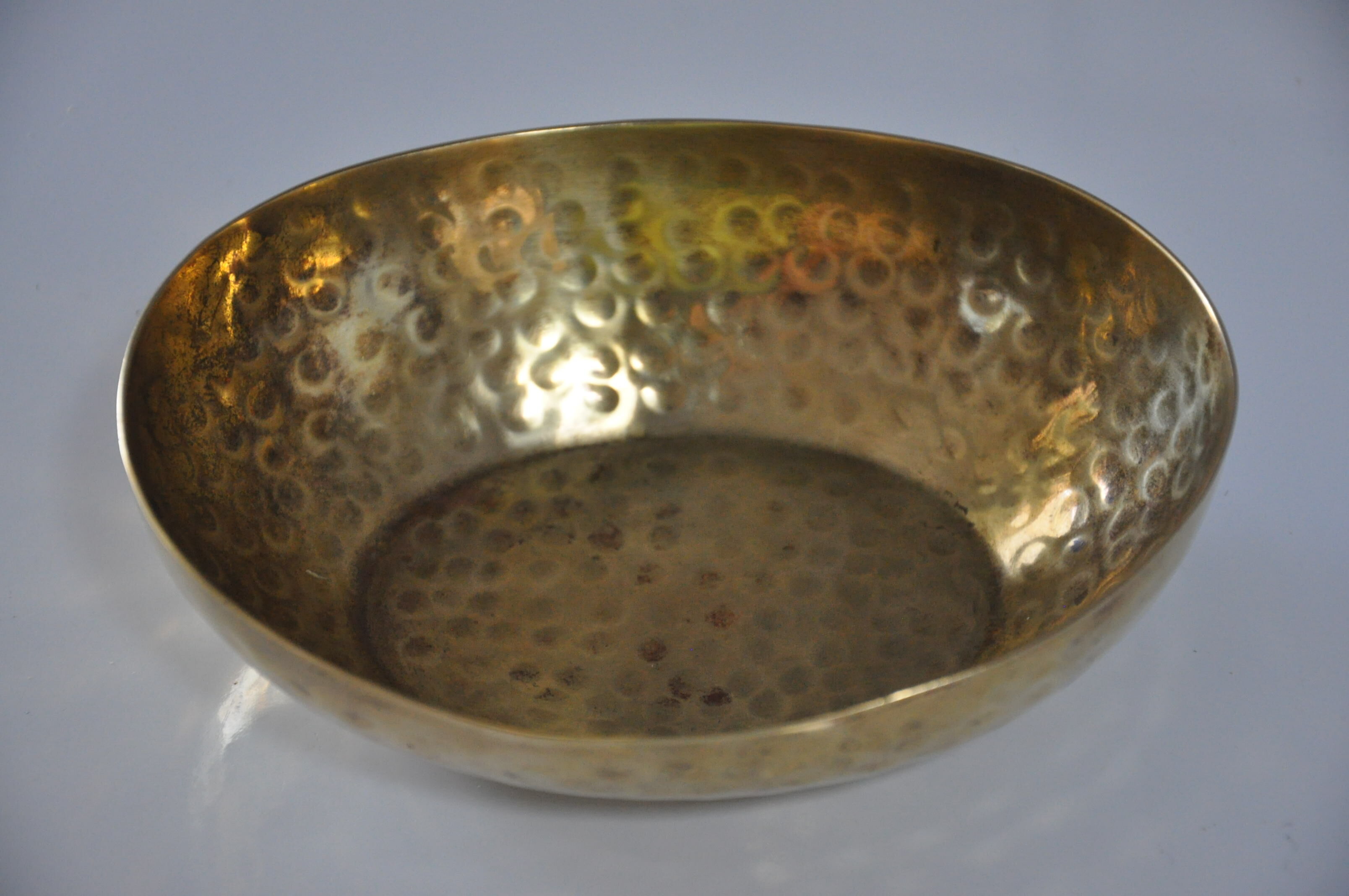 Empty hammered brass pocket