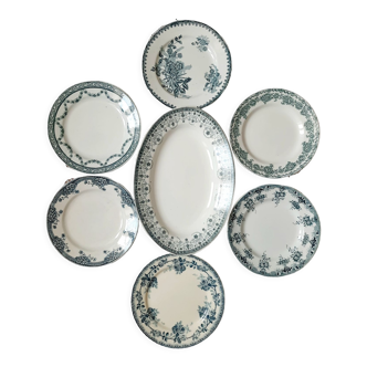 Old flat plates mismatched in iron earth accompanied by a serving dish