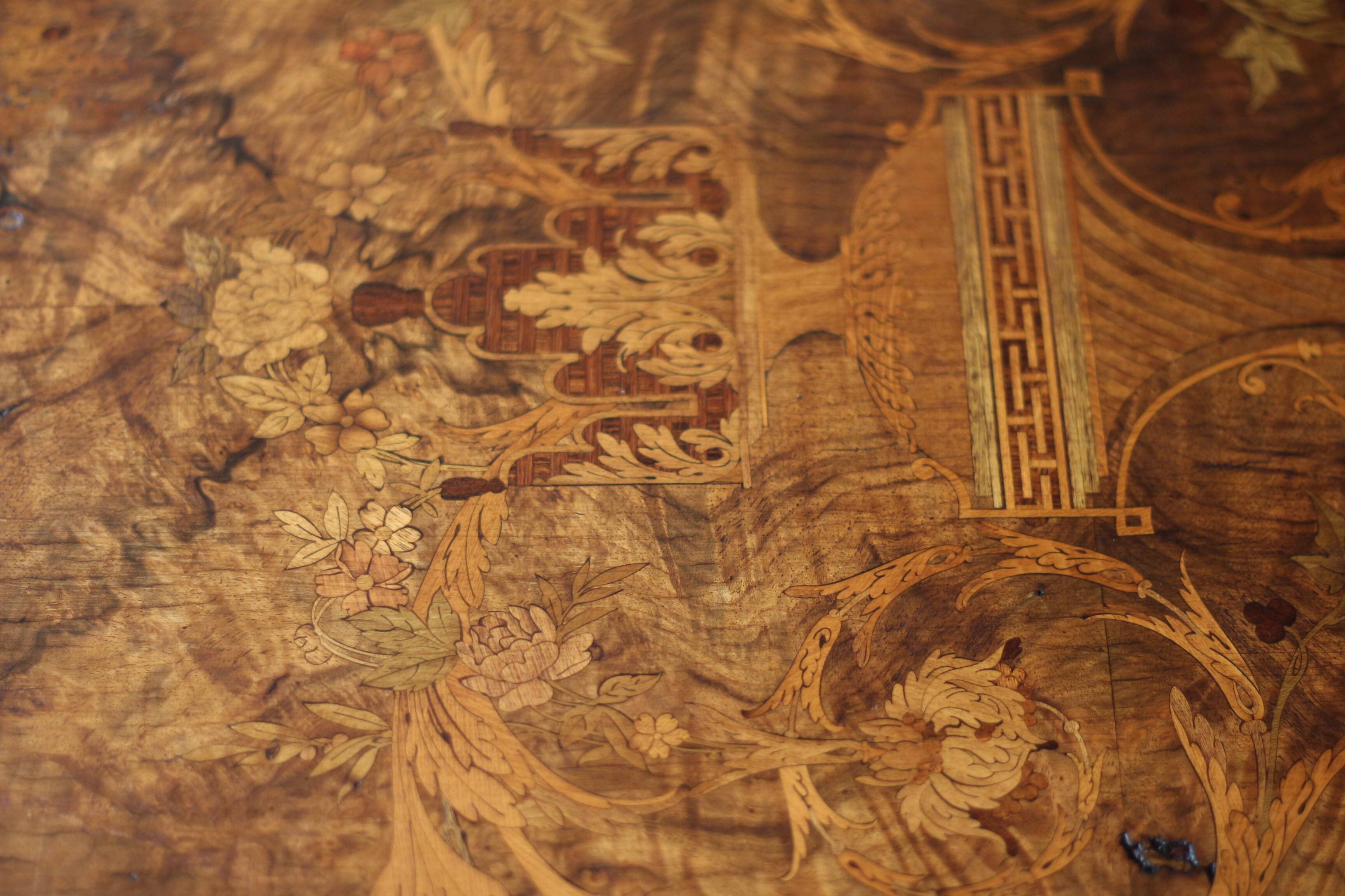 Superb Napoleon III table. Marquetry top and gilded bronzes.