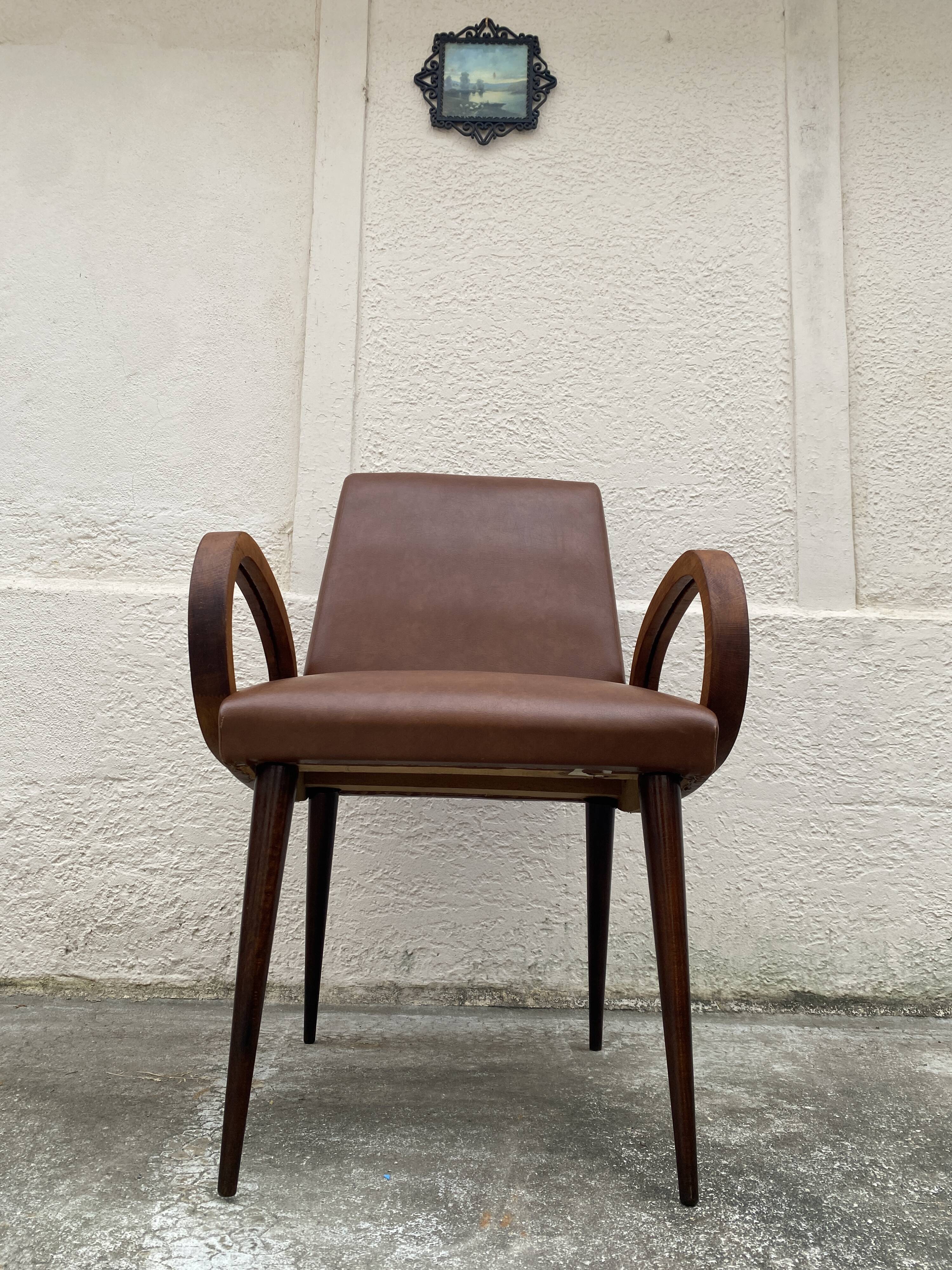 Mid-Century Scandinavian vintage retro armchair with oval armrests.