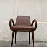 Mid-Century Scandinavian vintage retro armchair with oval armrests.