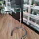 End of sofa, pedestal table, side table paget top in chrome-plated glass base