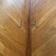 Mid-century wardrobe from the 1960s in wood, with a chevron front and tapered legs.