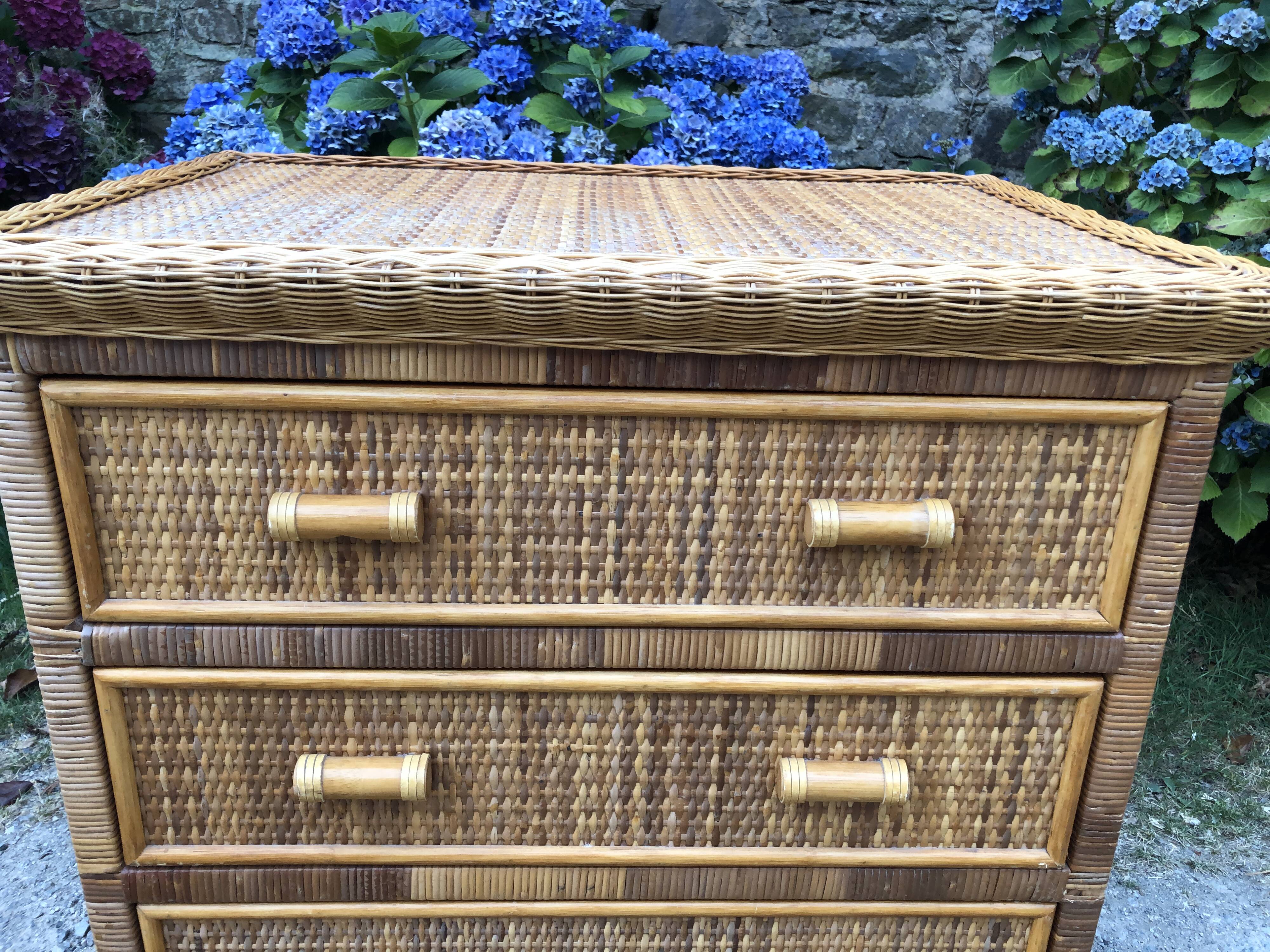 Vintage rattan chest of drawers has 3 drawers.