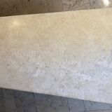 Travertine table with semi-round edges