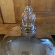 Large old glass bell and its wooden base