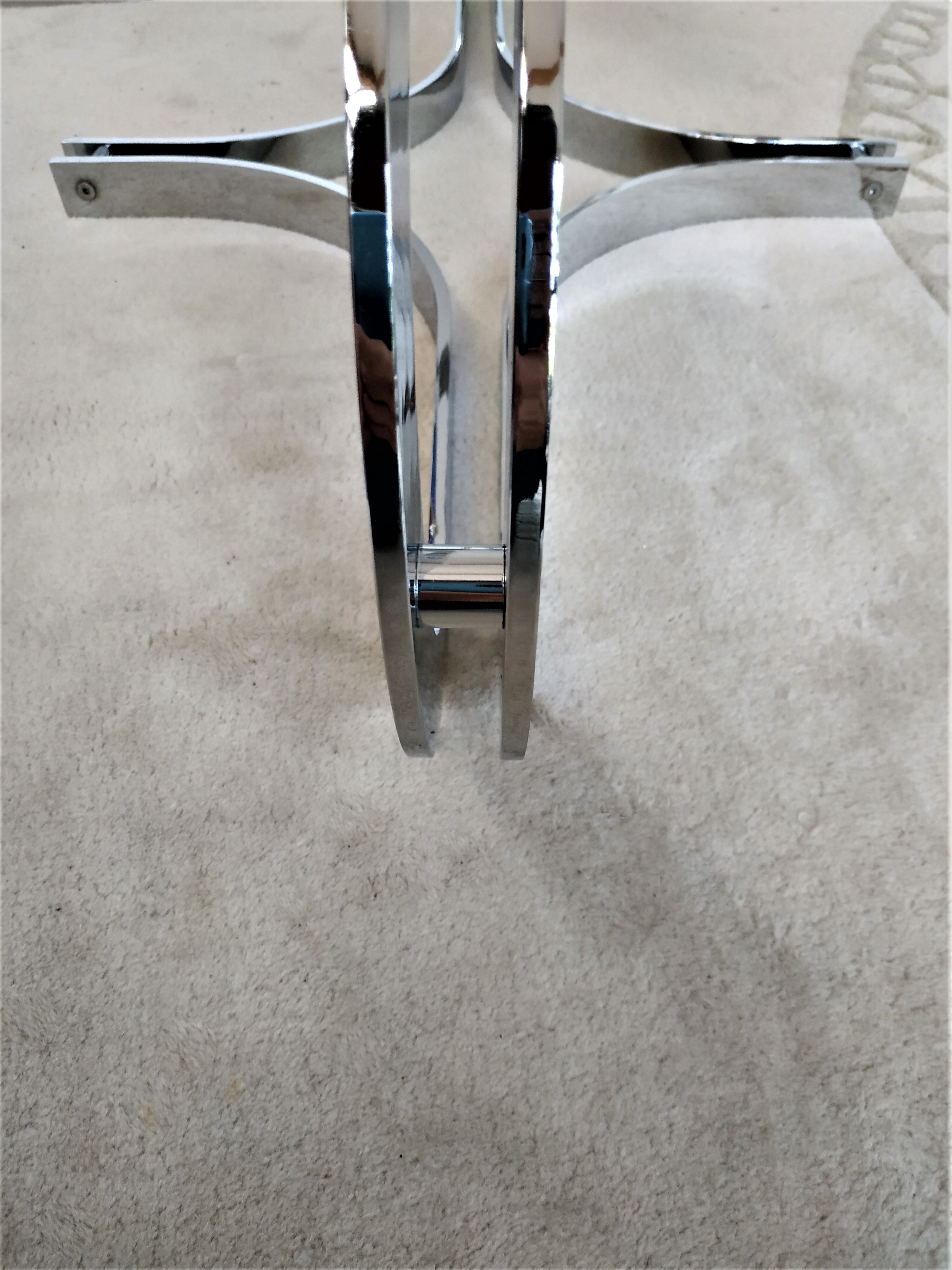 Chrome metal coffee table and oval smoked glass tray