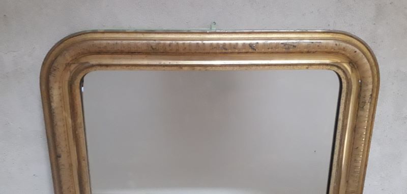 Golden Louis Philippe mirror H122xW84cm with gilded motifs.