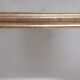 Golden Louis Philippe mirror H122xW84cm with gilded motifs.
