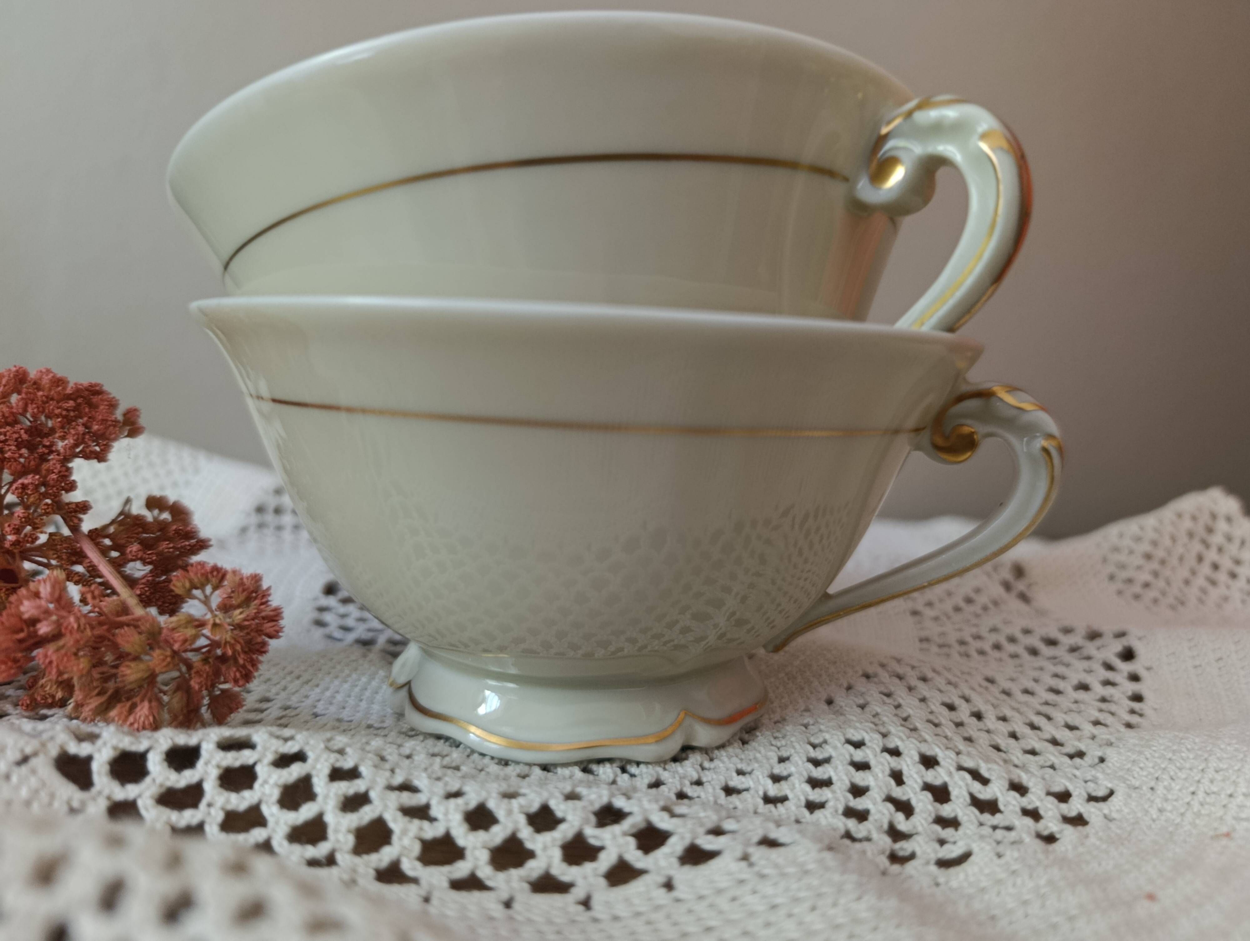 Two retro country-style porcelain tea cups, Former Royal Manufacture