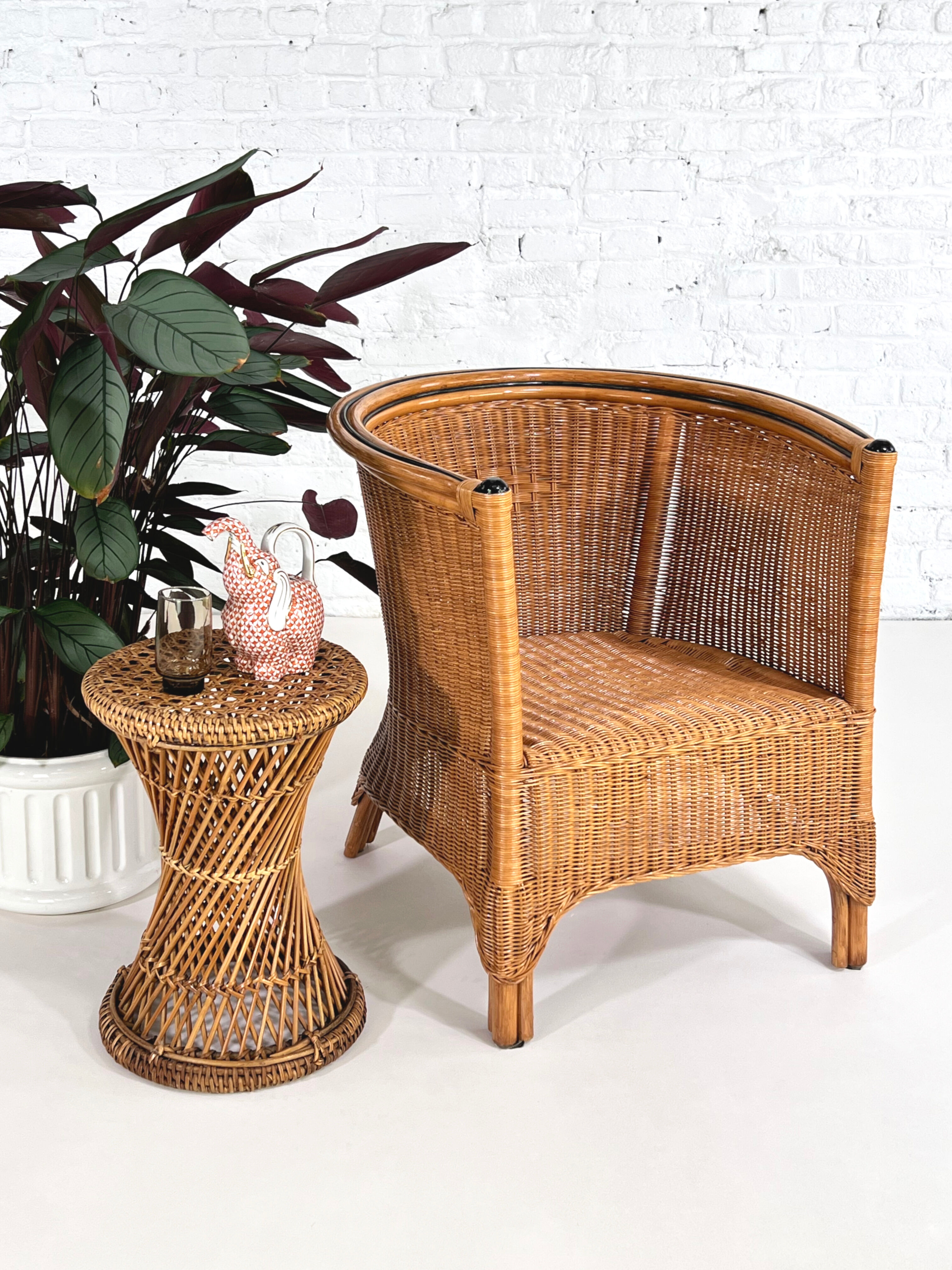 Pair of cabriolet armchairs in wicker and black edging