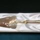 Golden metal pie shovel stamped Fabiora