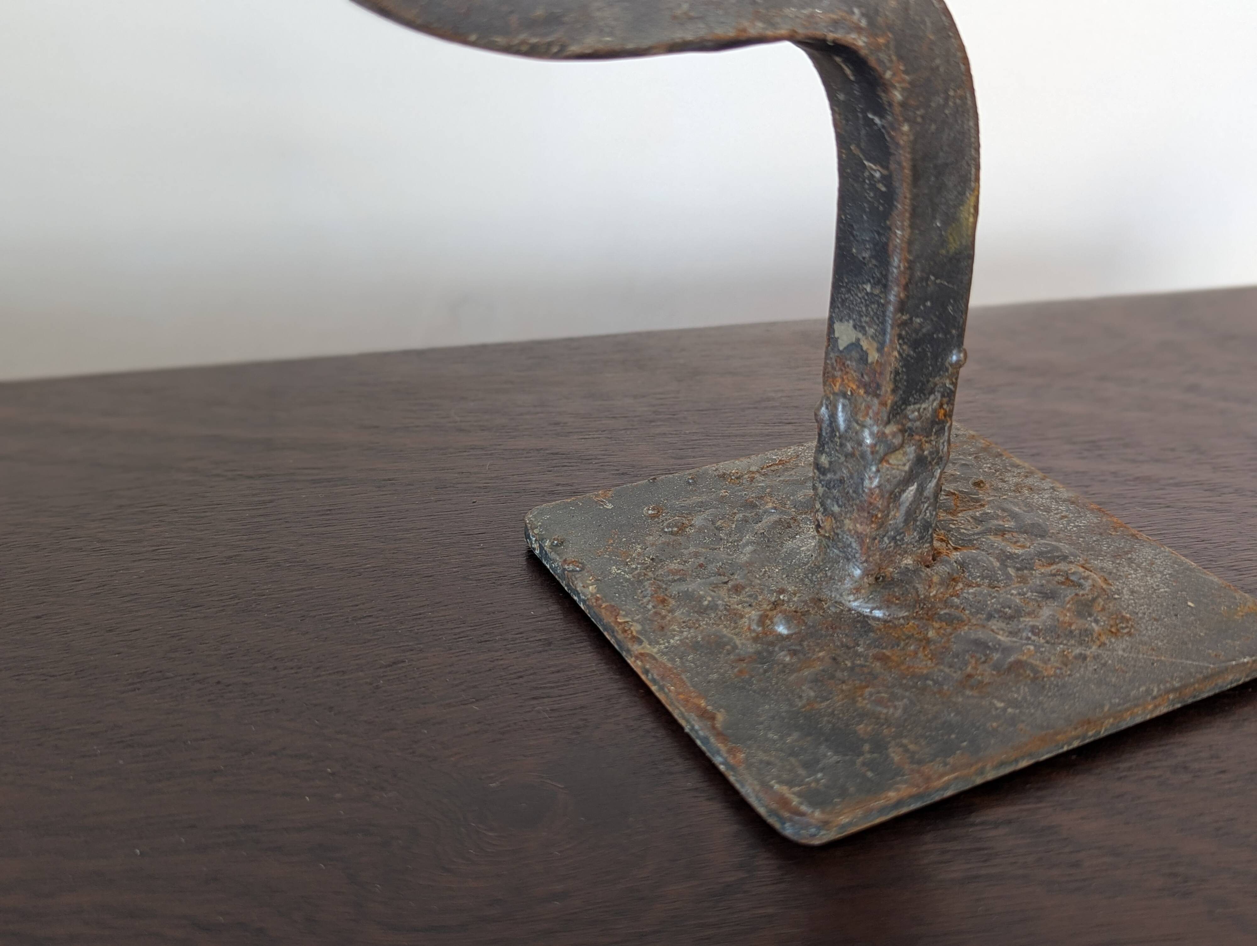 Pair of wrought iron candlesticks