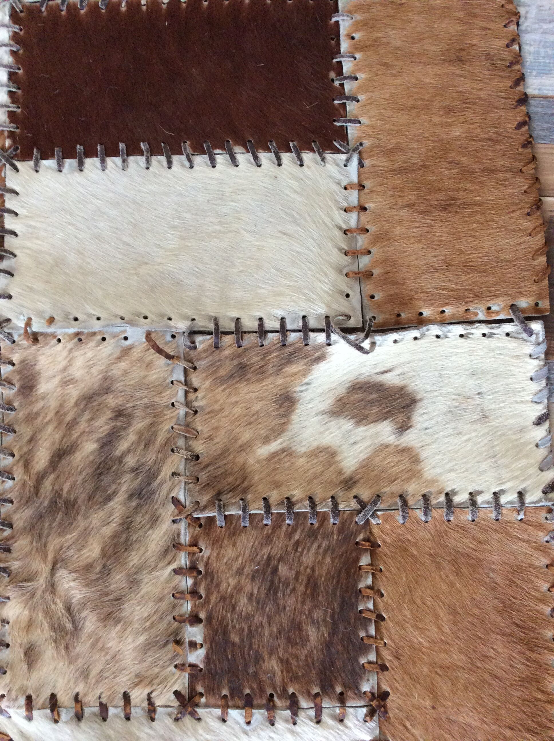 Patchwork carpet in cowhide 164x105cm from the 70s