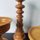 Vintage decor trio: candlestick and light wood bowls in Scandinavian style.