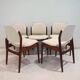 Set of six hardwood chairs by Arne Vodder for Sibast with white textile upholstery.