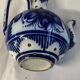 Glazed ceramic carafe with floral decoration