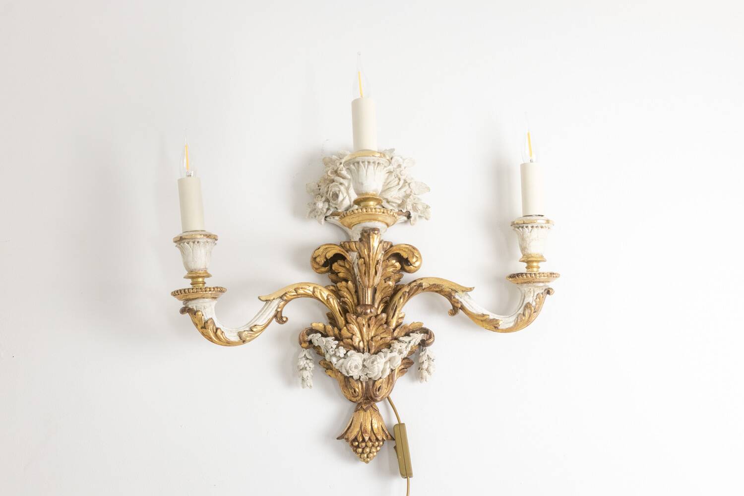 Pair of Louis XVI style wall lights in gilded and lacquered wood. Circa 1900.