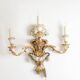 Pair of Louis XVI style wall lights in gilded and lacquered wood. Circa 1900.