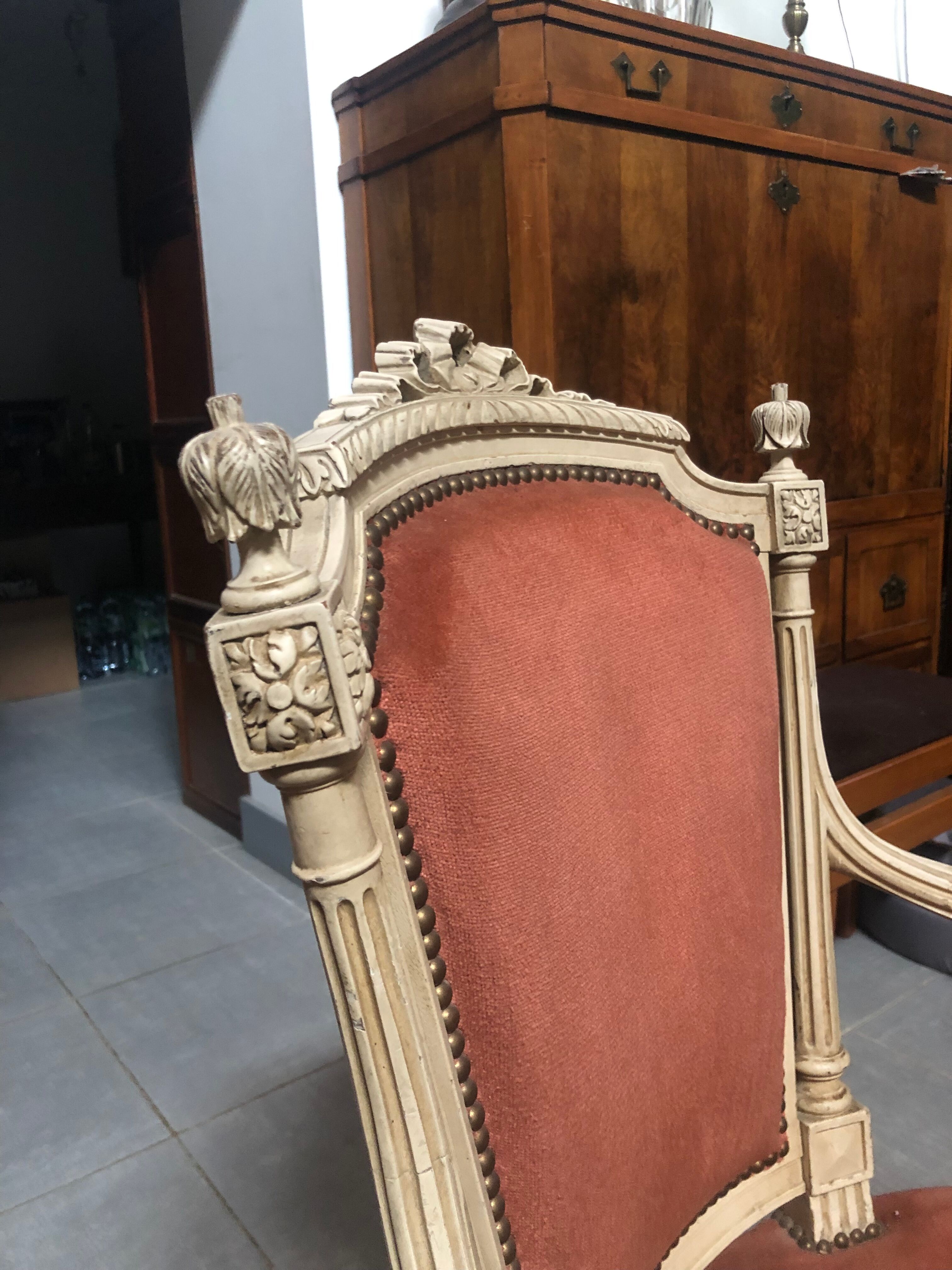 Patinated armchair in Louis XVI style