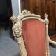 Patinated armchair in Louis XVI style
