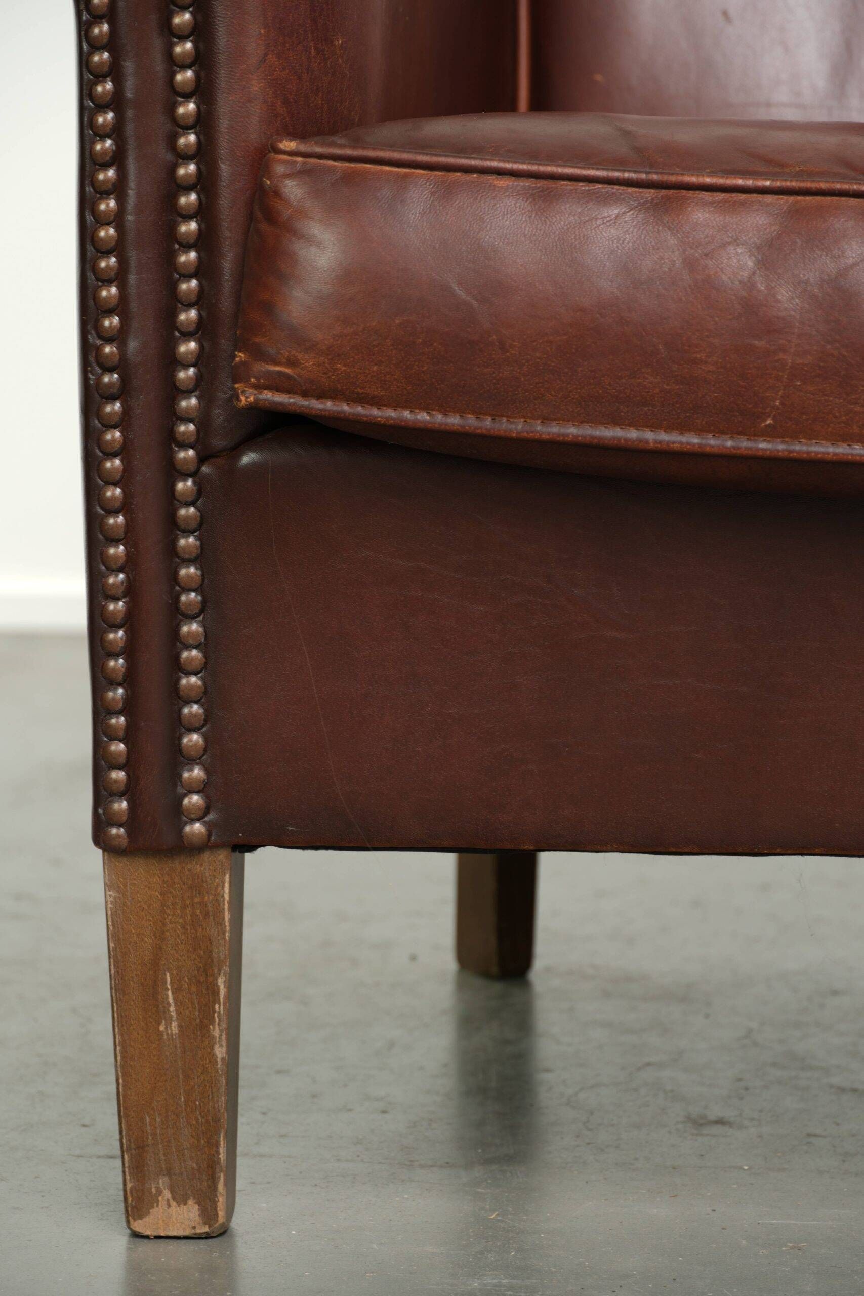 Sheepskin club armchair in English style with brown colour scheme