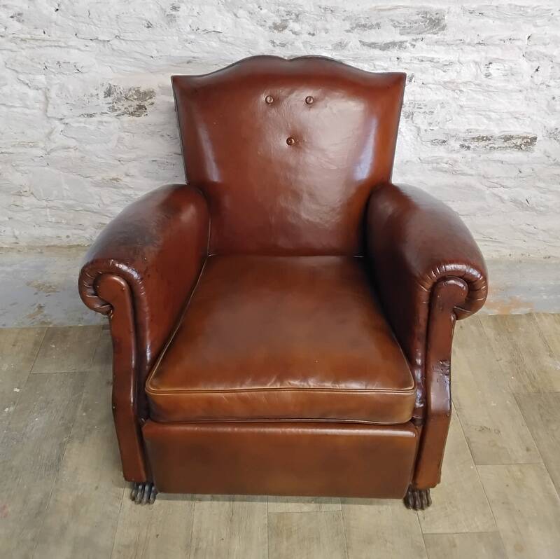 Club chair with moustache back and lion feet.