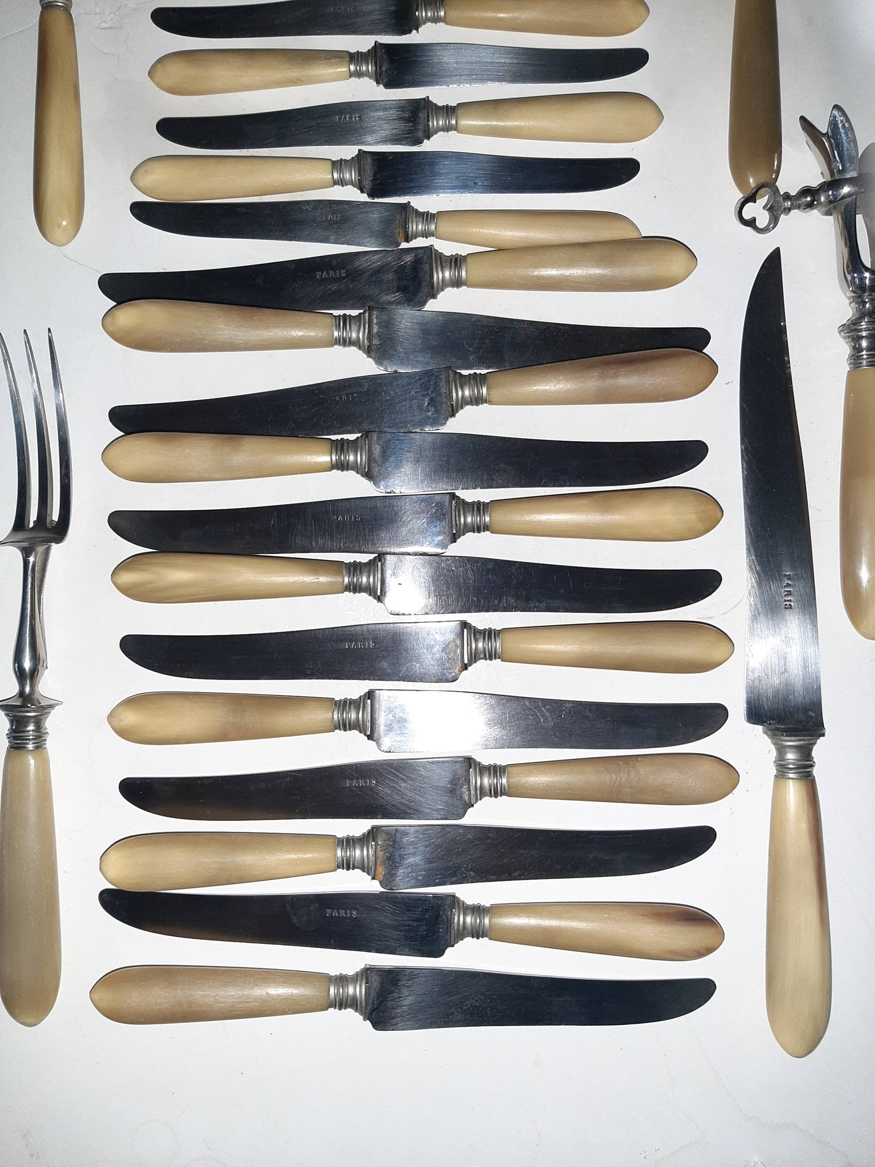 29-piece horn cutlery set, knives and serving utensils.