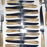 29-piece horn cutlery set, knives and serving utensils.