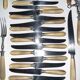 29-piece horn cutlery set, knives and serving utensils.
