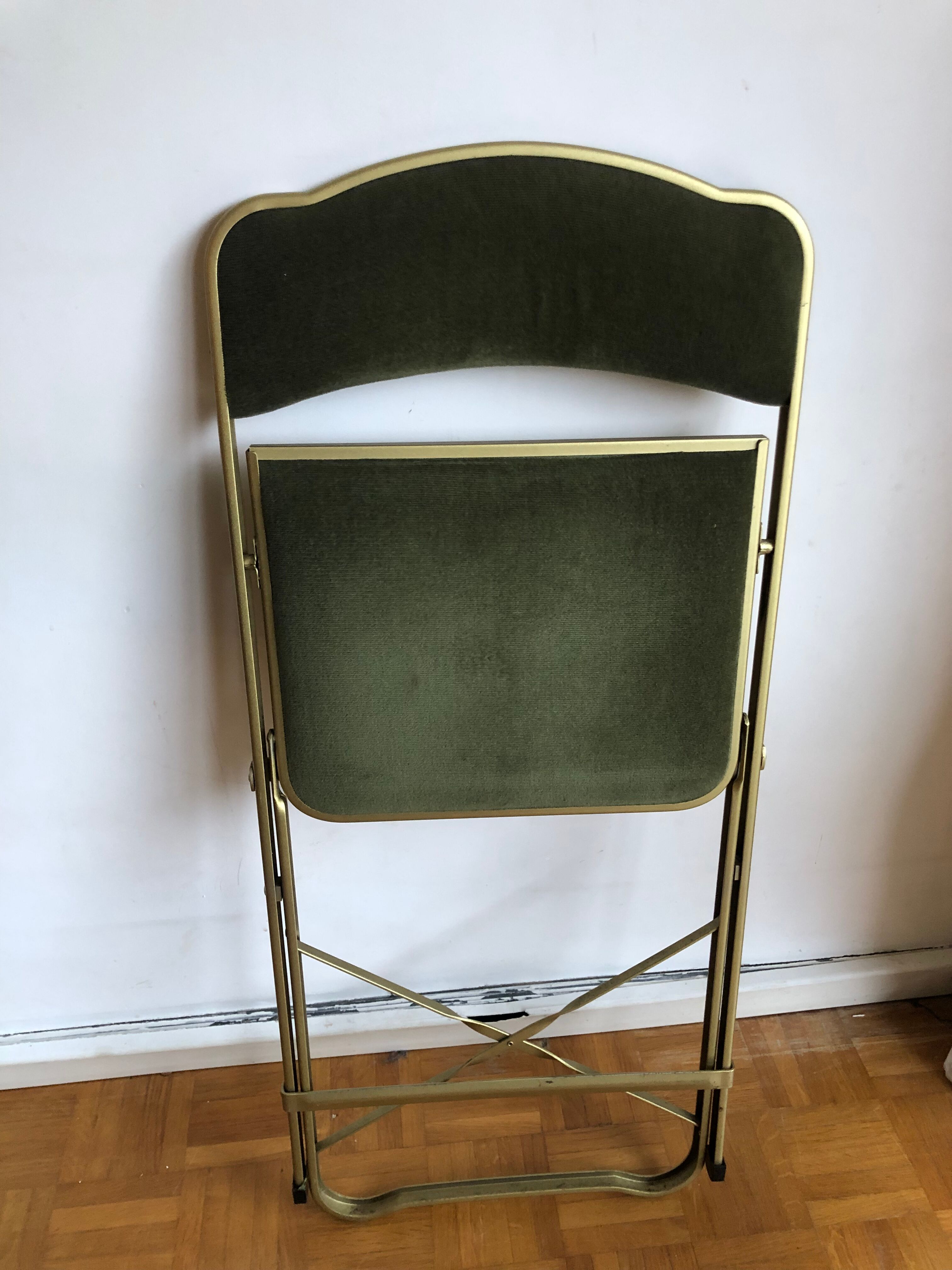 Set of three vintage green folding chairs