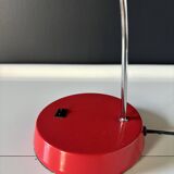 Vintage red lamp with a curved arm