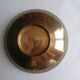 Enamelled brass stand with floral decoration.