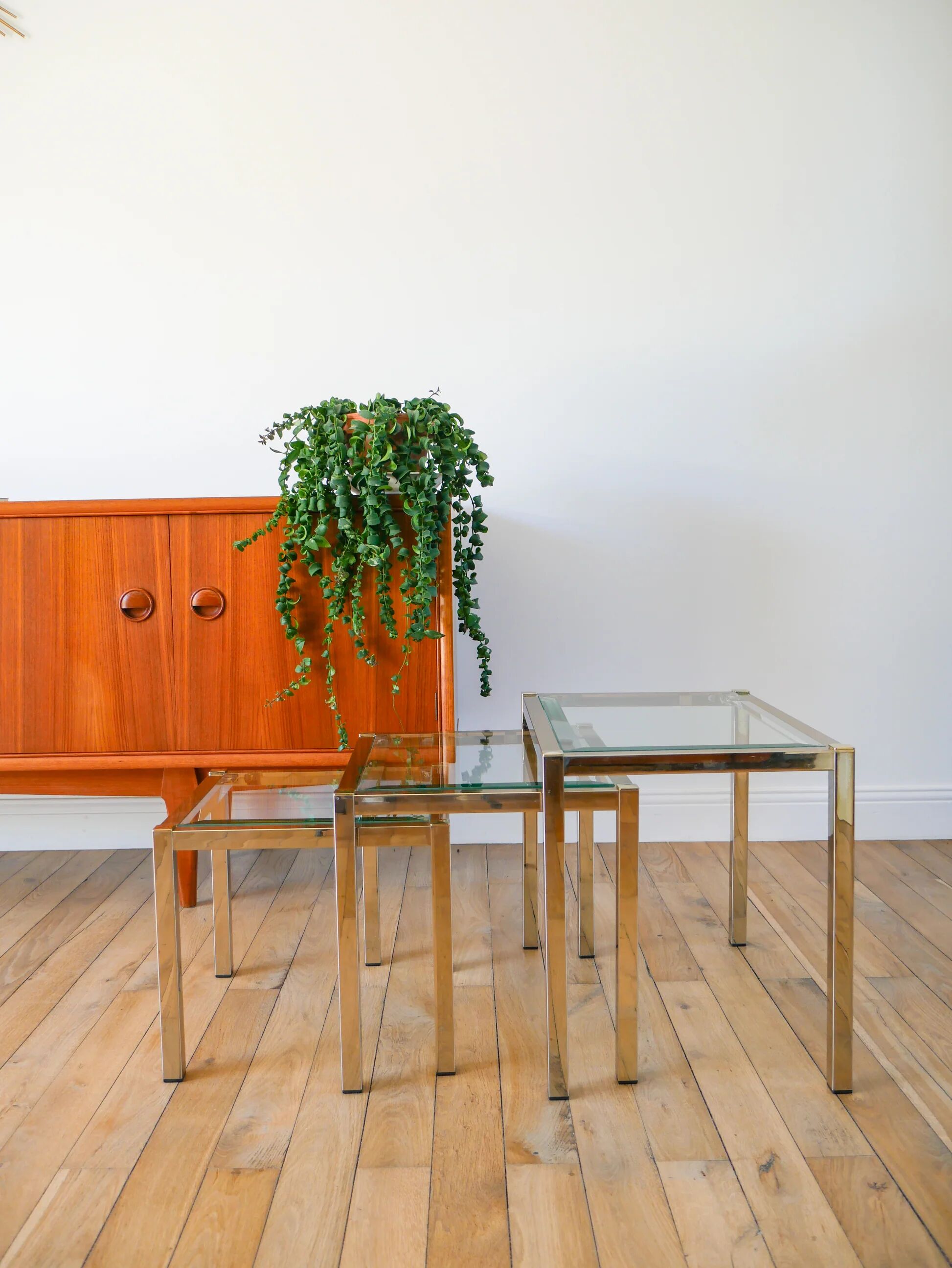 Set of three nesting coffee tables, gilt brass with beveled glass tops, 1980