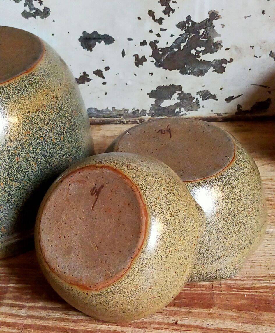 Three nesting pottery salad bowls in glazed stoneware
