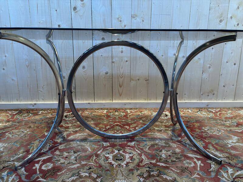 Contemporary glass and chrome dining table.