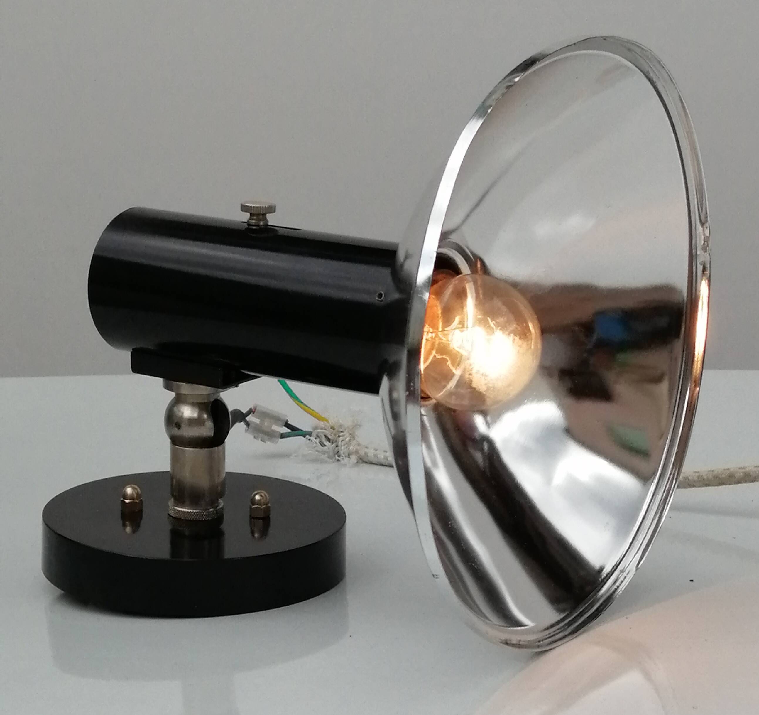 Adjustable black and chrome wall light from Raak, vintage 1960.