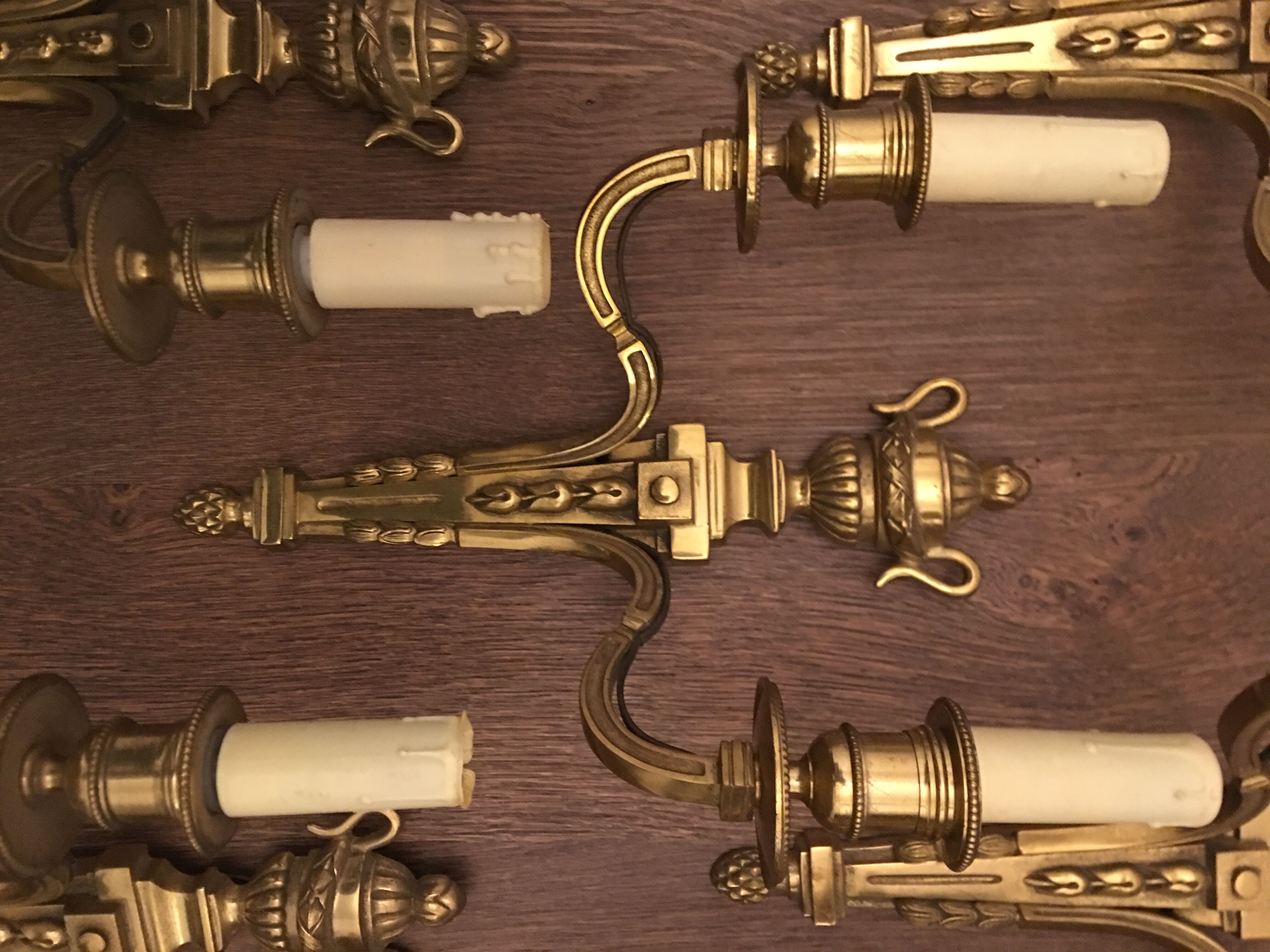 Eleven gilded bronze wall lamps