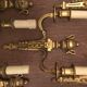 Eleven gilded bronze wall lamps