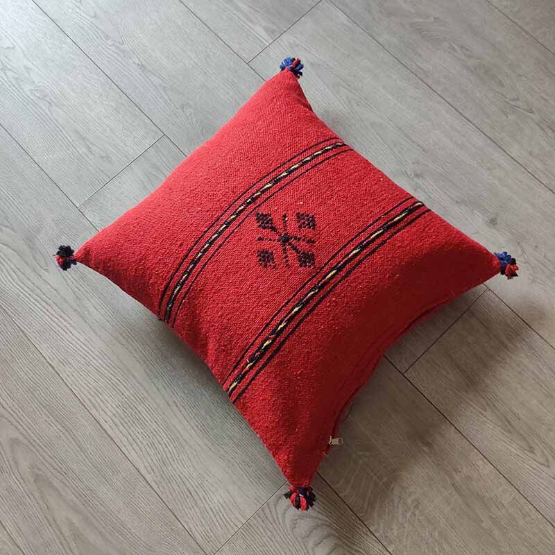 Red Berber cushion with cotton pompom