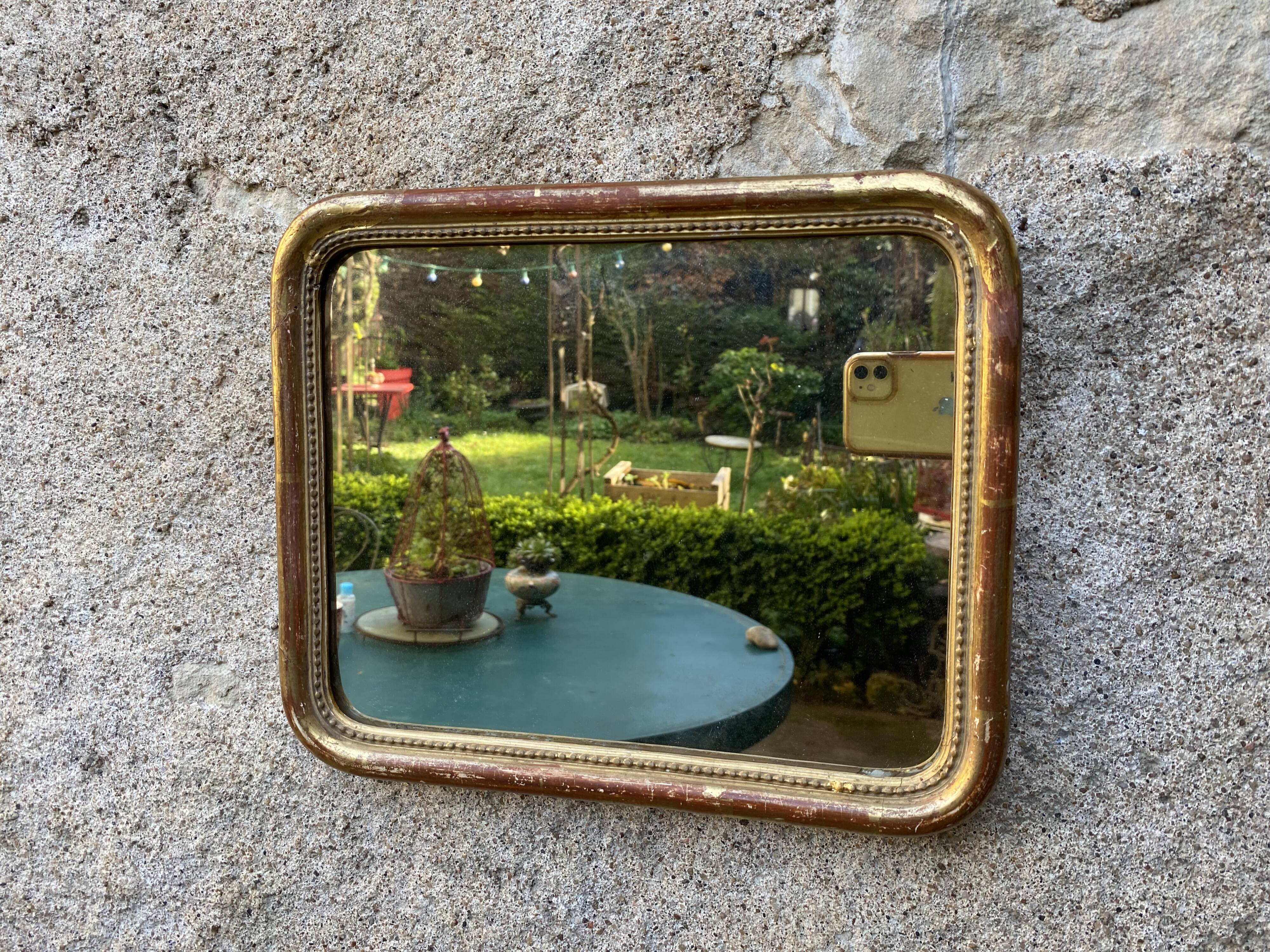 Louis-Philippe mirror gilded with gold leaf
