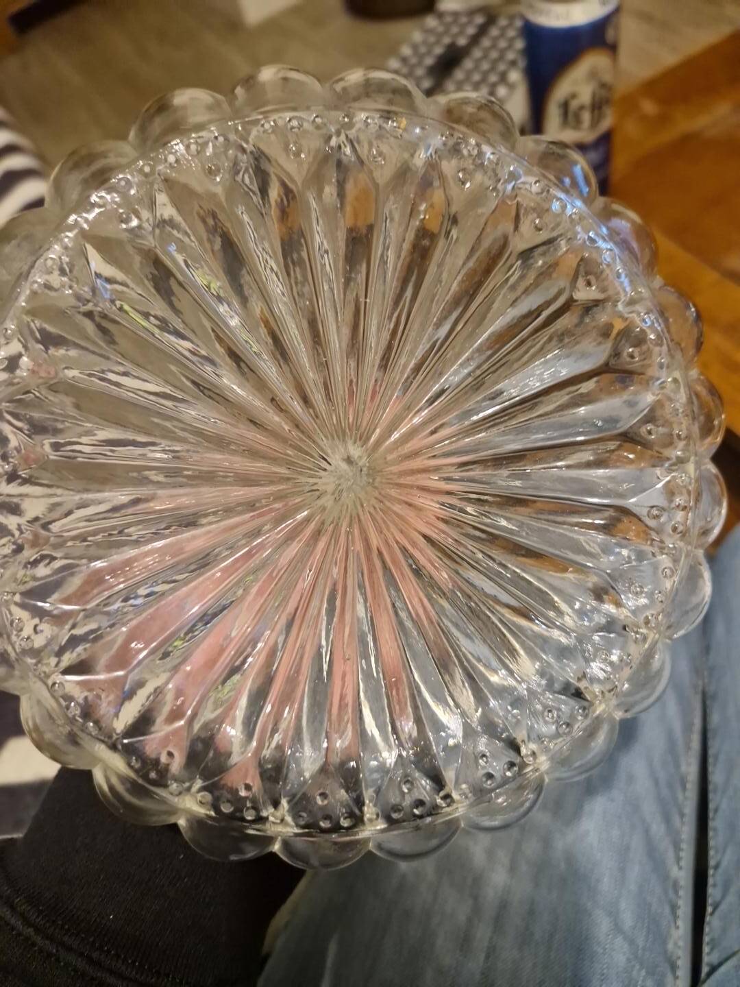 Antique cut glass spirit decanter with silver-plated neck and spout.