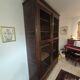 Library in marquetry with a grille from the Louis XVI period.
