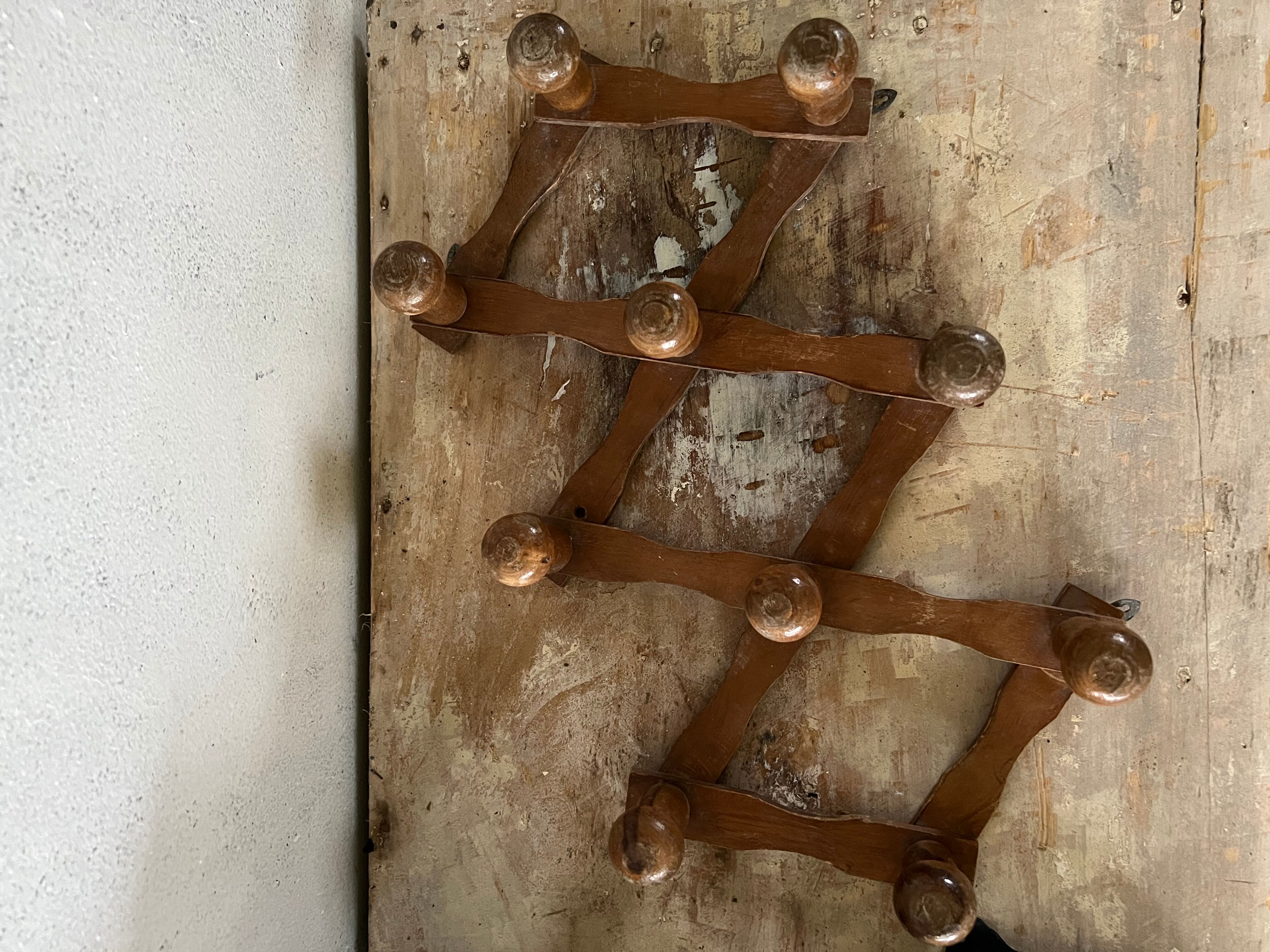 Wooden accordion wall coat rack