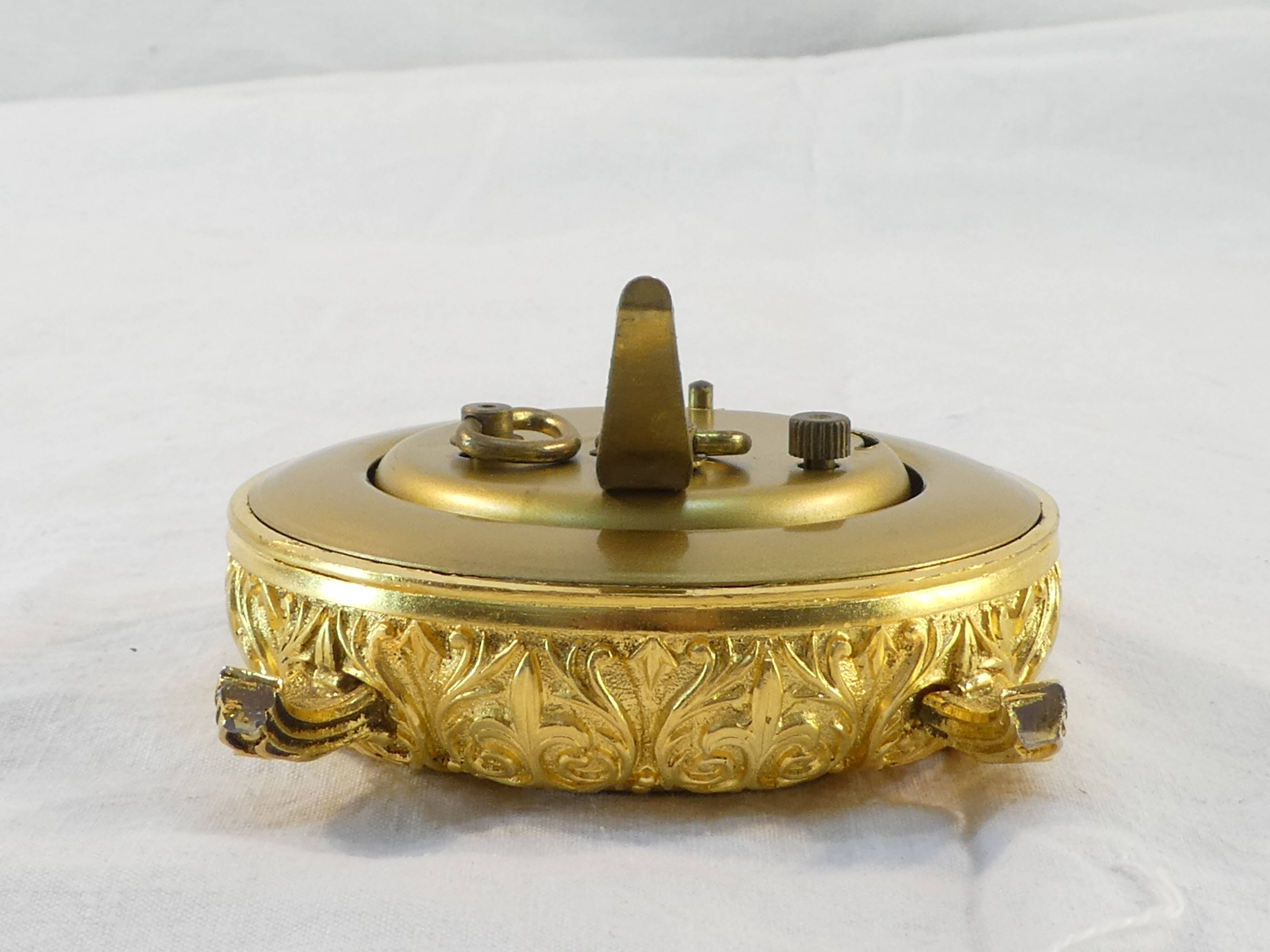 LANCEL alarm clock in chiseled bronze and gilded metal