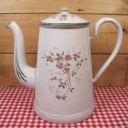 Old coffee maker in enamelled sheet metal brand bb 1900s , decoration of roses , kitchen utensils