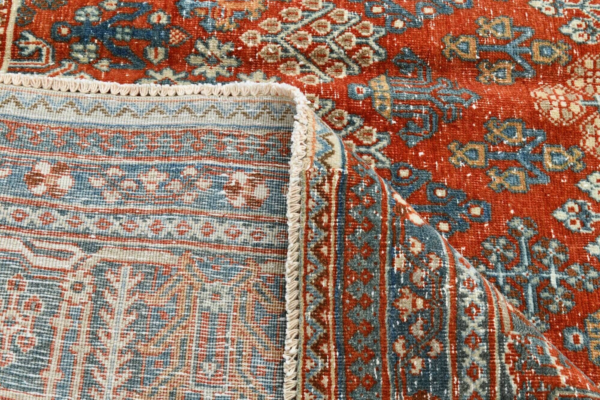 Vintage Turkish rug in brick red and indigo with floral design, 276 × 389 cm